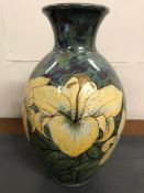 Highland stoneware vases decorated with lillies. H43cm