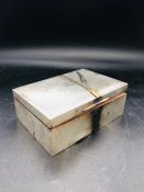 A silver cigarette case, HCD makers mark, Birmingham hallmark.