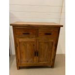 A hardwood two door cabinet (H90cm W80cm D40cm)