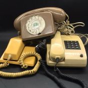 A Vintage Siemens push button phone and two other vintage phones.