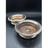 A Pair of hallmarked silver wine coasters, makers mark BES & Co, Birmingham.