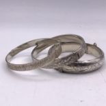 Three silver bangles