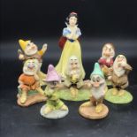 Eight boxed Royal Doulton Snow White and the seven Dwarfs figures