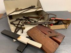 A selection of vintage carpentry tools and other items