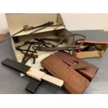 A selection of vintage carpentry tools and other items