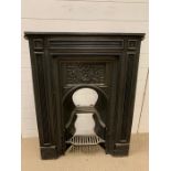 A cast iron fire place surround and grate (H102cm W81cm)
