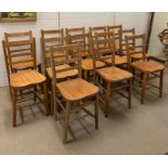 Thirteen oak school chairs