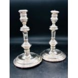 A Pair of Silver candlesticks, makers mark RC, London Hallmark (20 cm H)