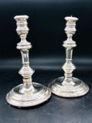 A Pair of Silver candlesticks, makers mark RC, London Hallmark (20 cm H)