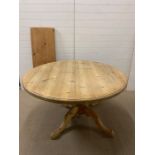 A large extendable pine table with one extra leaf (H77cm W135cm) (leaf 45cm)