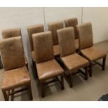 Eight leather dining chairs