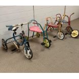 Four vintage children's trikes