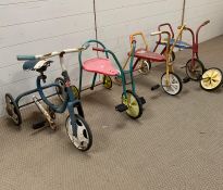 Four vintage children's trikes