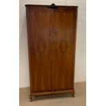 A two door wardrobe (H186cm W94cm)