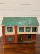 A vintage wooden dolls house