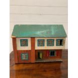 A vintage wooden dolls house