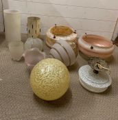 A selection of various glass lampshades