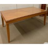 An eight seater dining table with glass top (H78cm W184cm D100cm)