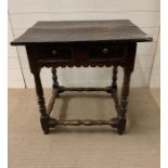 A Late 17th Century oak side table, rectangular top on block and ring turned legs, joined by