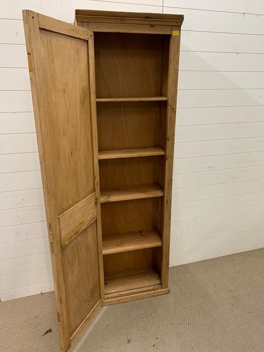 A tall pine hall cupboard opening to reveal shelves (H188cm W58cm D29cm) - Image 2 of 2