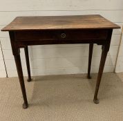 A Jointed Oak side table on pad feet H 70 cm W 77cm x D 40cm