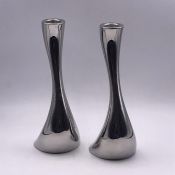 A pair of Gerog Jensen tea light/candle holders