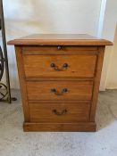 An oak bedside with three drawers (H64cm W55cm D54cm)