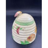 A hand painted honey pot by Clarice Cliff