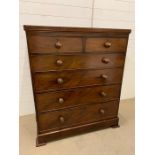 A mahogany chest of drawers two over four long (H125cm W104cm D50cm)