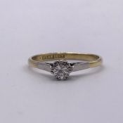 A solitaire diamond (0.25ct) ring on 18ct yellow gold and platinum mount.