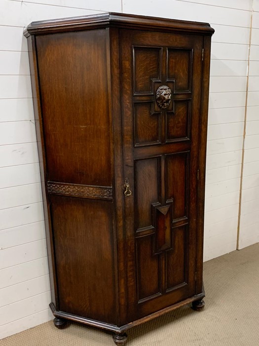 A oak hall cupboard/wardrobe with carved lion head decoration - Image 2 of 3