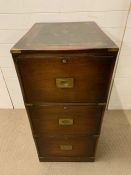 A mahogany office filing cabinet with brass handles in the campaign style (H104cm W50cm D65cm)