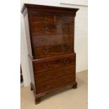 An mahogany chest on chest, the top with molded cornice, two short and three long graduated drawers,