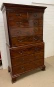 An mahogany chest on chest, the top with molded cornice, two short and three long graduated drawers,