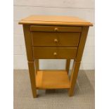 A pine bedside cabinet with drawers (H68cm D39cm W40cm)