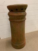 A terracotta chimney pot with original cowls (H70cm)
