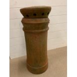 A terracotta chimney pot with original cowls (H70cm)