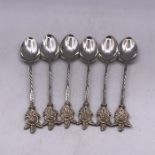 A Set of Six White Metal teaspoons.