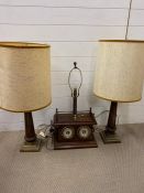 A desk top lamp with temperate gauges and a pair of table lamps on brass bases