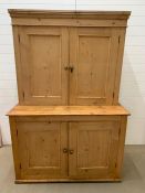 A Pine Pantry Cupboard with brass handles, both sets of cupboards are shelved (W 130cm x D 59 cm x H