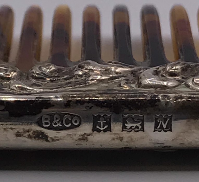 A Ladies silver backed brush and hallmarked silver handled comb. - Image 2 of 4