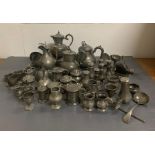 A Large volume of pewter items to include: measures, pepper pots, egg cups, salts, soup ladles,