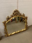 A gilt over mantle wall mirror with carved frame (120cm x 112cm)