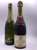 A Bottle of Moet champagne and a bottle of Pommery champagne.