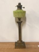 A brass column oil lamp