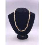 A Pearl necklace with hallmarked 9 ct gold clasp