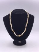 A Pearl necklace with hallmarked 9 ct gold clasp