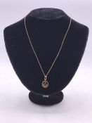 A 9ct gold Masonic pendant, on a 9ct gold neckchain with a boltring clasp. (2.5g)