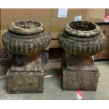 Two garden stone flower pots on square bases