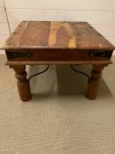 An Indian Hardwood side table with metal stretchers (60 cm sq x 42 cm High)